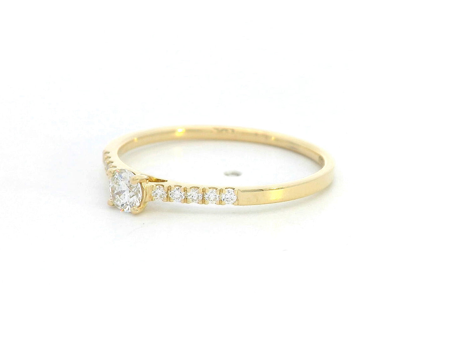 18K yellow gold ring with 0.18ct round center diamond and 10 smaller side diamonds set in a classic straight design.