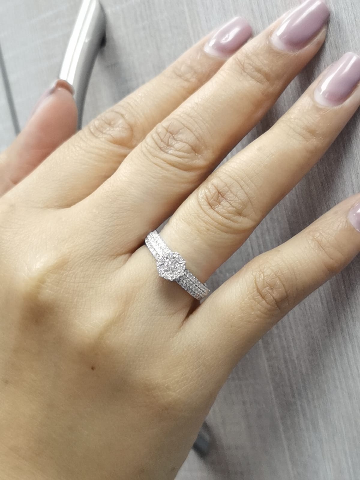 18K gold diamond cluster engagement ring with triple-row diamond band and 0.70ct total diamond weight