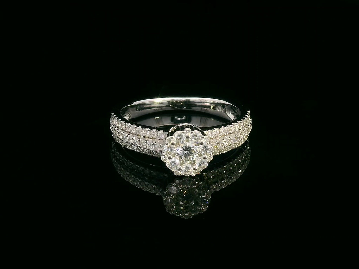 18K gold diamond cluster engagement ring with triple-row diamond band and 0.70ct total diamond weight