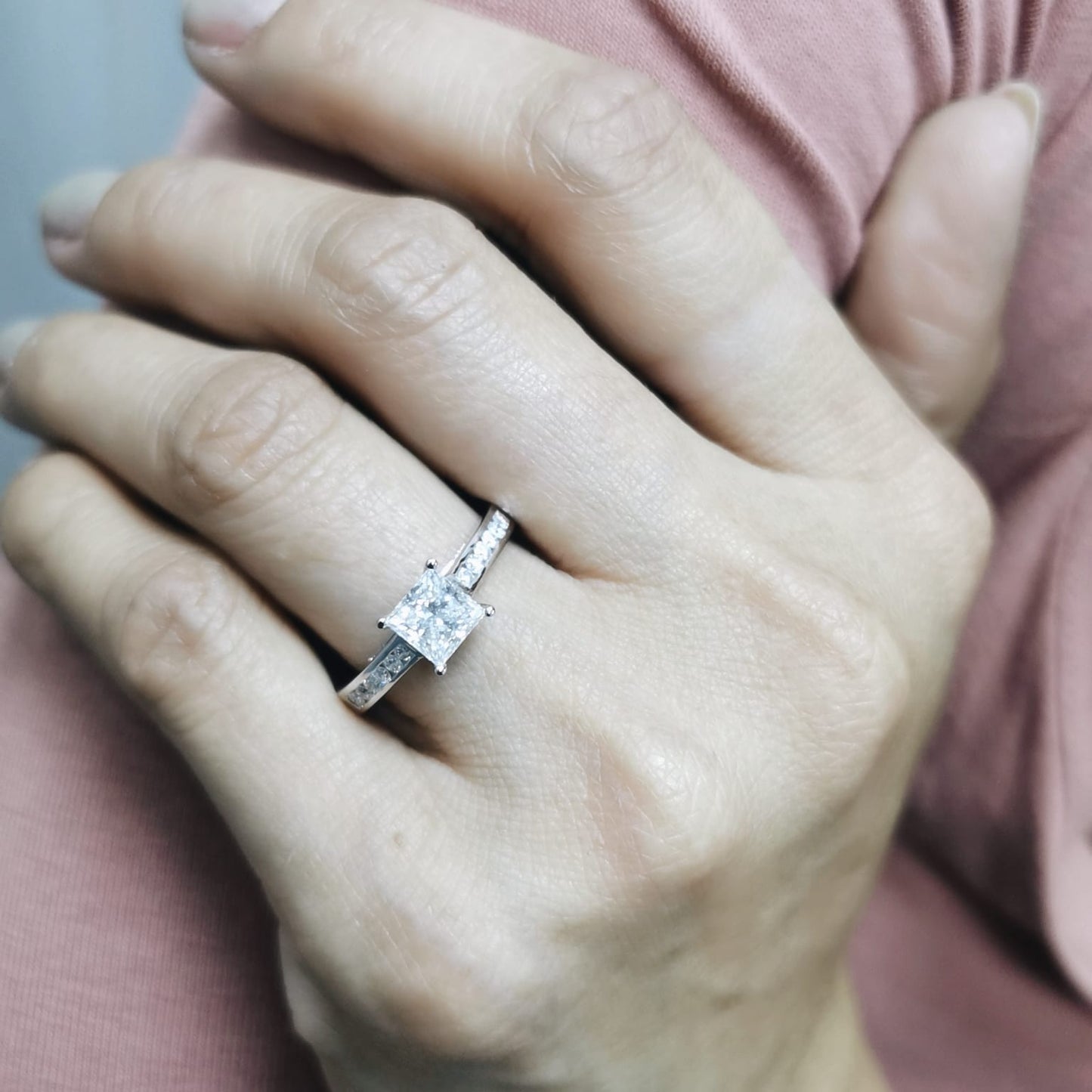 Princess-cut diamond engagement ring in 18K white gold with channel-set accent diamonds