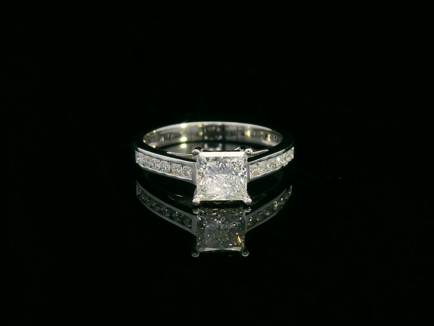 Princess-cut diamond engagement ring in 18K white gold with channel-set accent diamonds