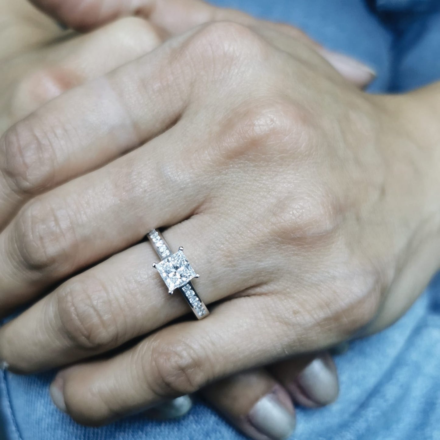 Princess-cut diamond engagement ring in 18K white gold with channel-set accent diamonds