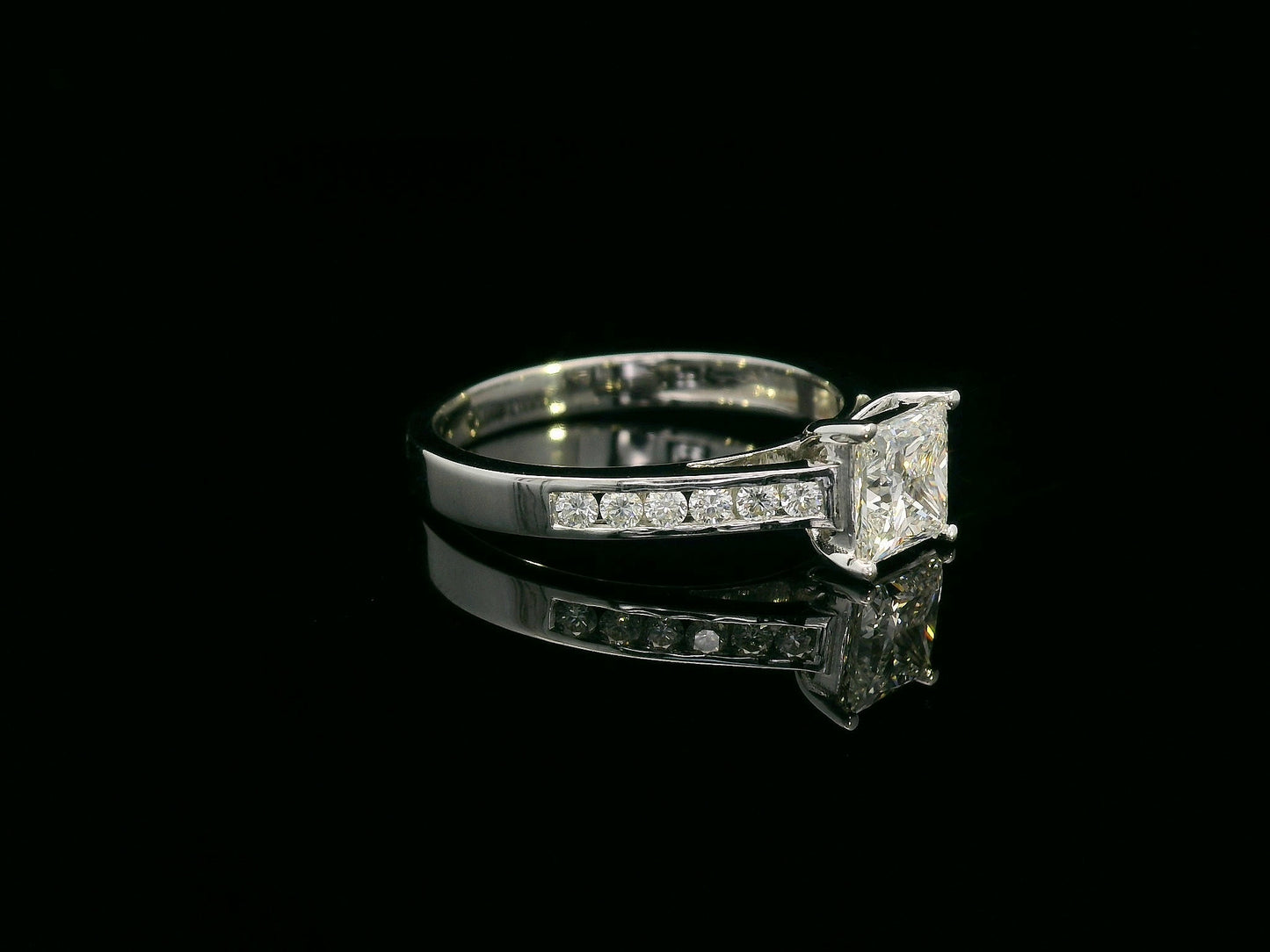 Princess-cut diamond engagement ring in 18K white gold with channel-set accent diamonds