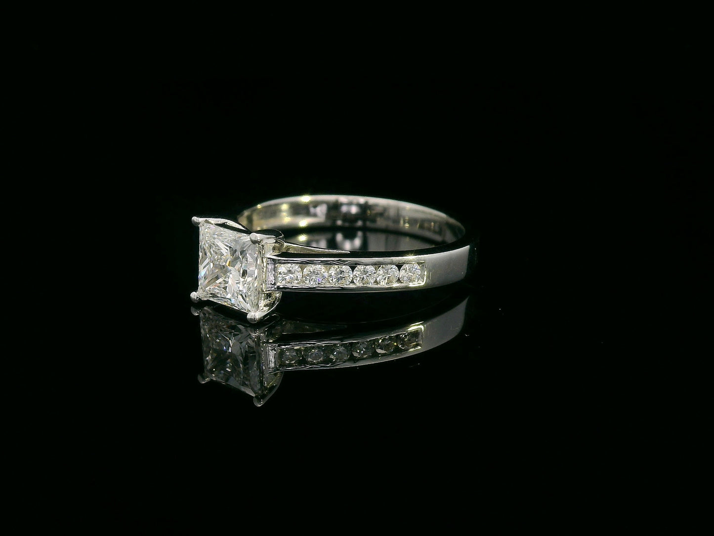 Princess cut diamond ring 1.01 carat in 18K white gold with pavé diamond band