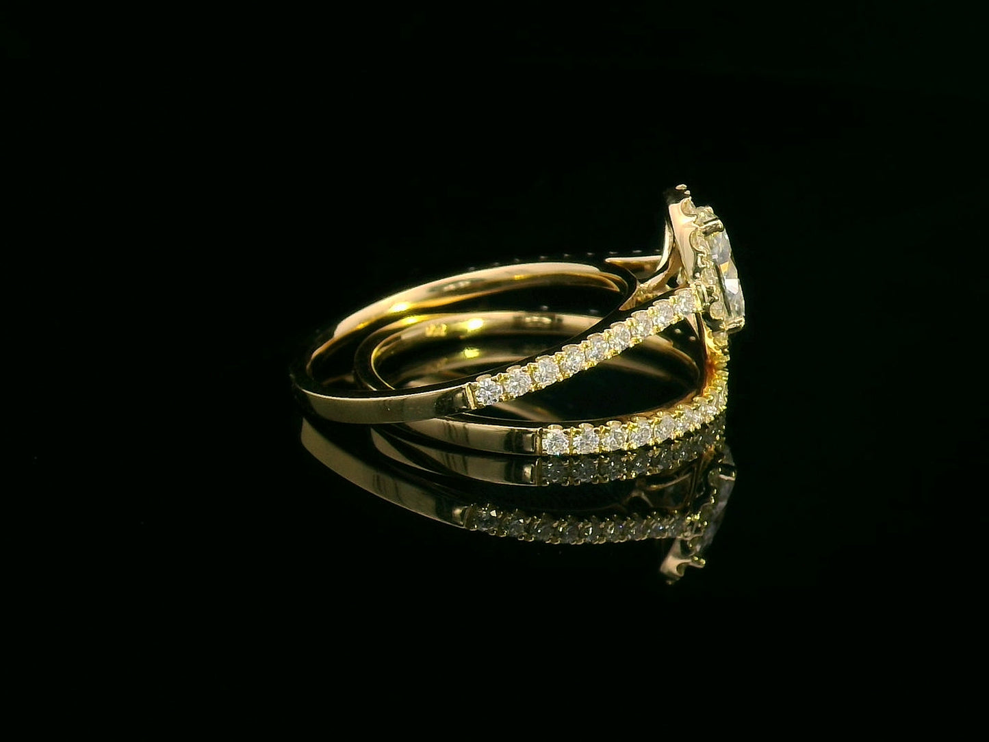 Oval diamond halo bridal set in 18K gold with pavé engagement ring and matching wedding band