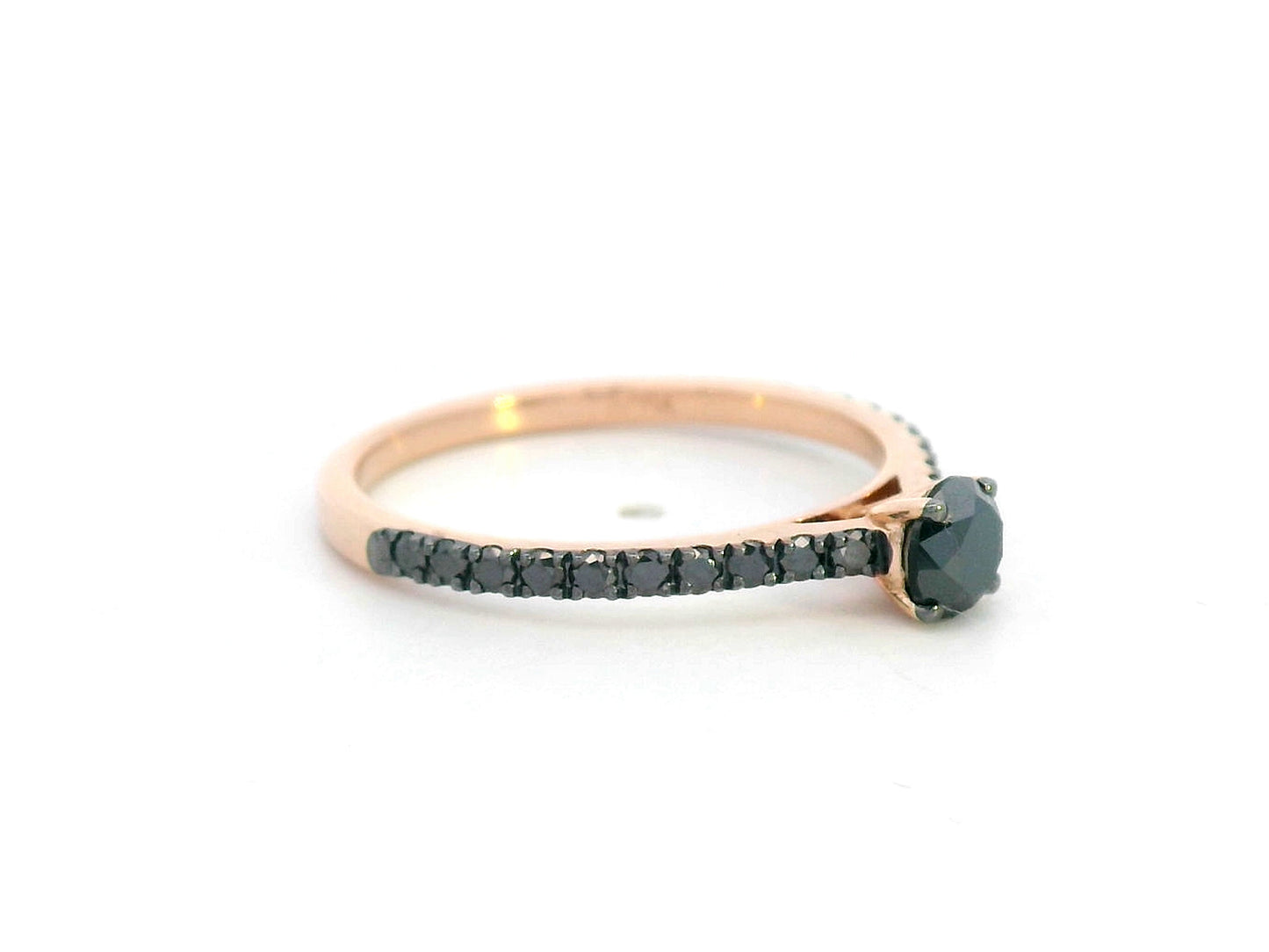18K gold ring with round black center diamond and half eternity black diamonds along the band, modern minimalist style.
