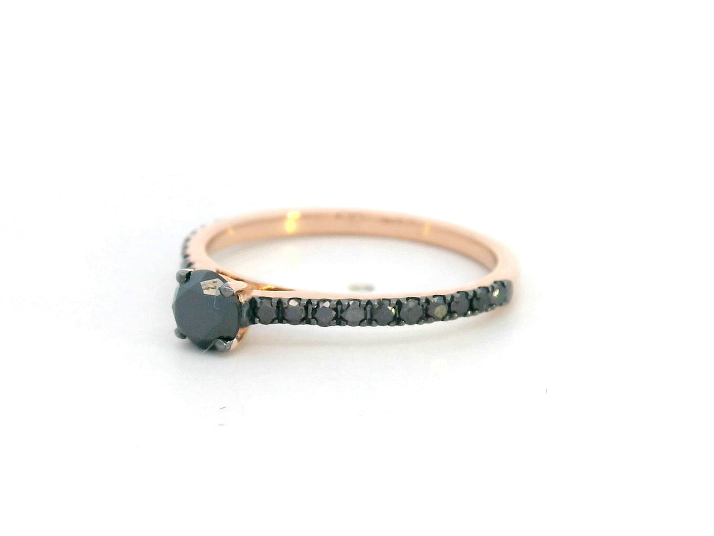 18K gold ring with round black center diamond and half eternity black diamonds along the band, modern minimalist style.