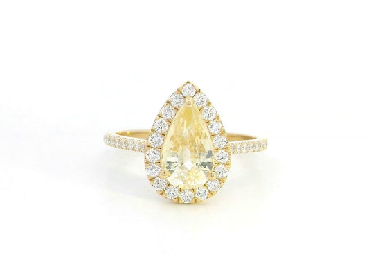 18K yellow gold ring with 2.18ct pear-shaped yellow sapphire and 0.48ct diamond halo and band