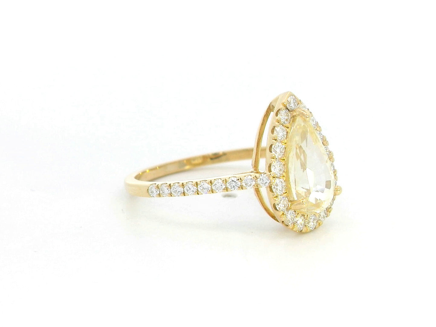 18K yellow gold ring with 2.18ct pear-shaped yellow sapphire and 0.48ct diamond halo and band