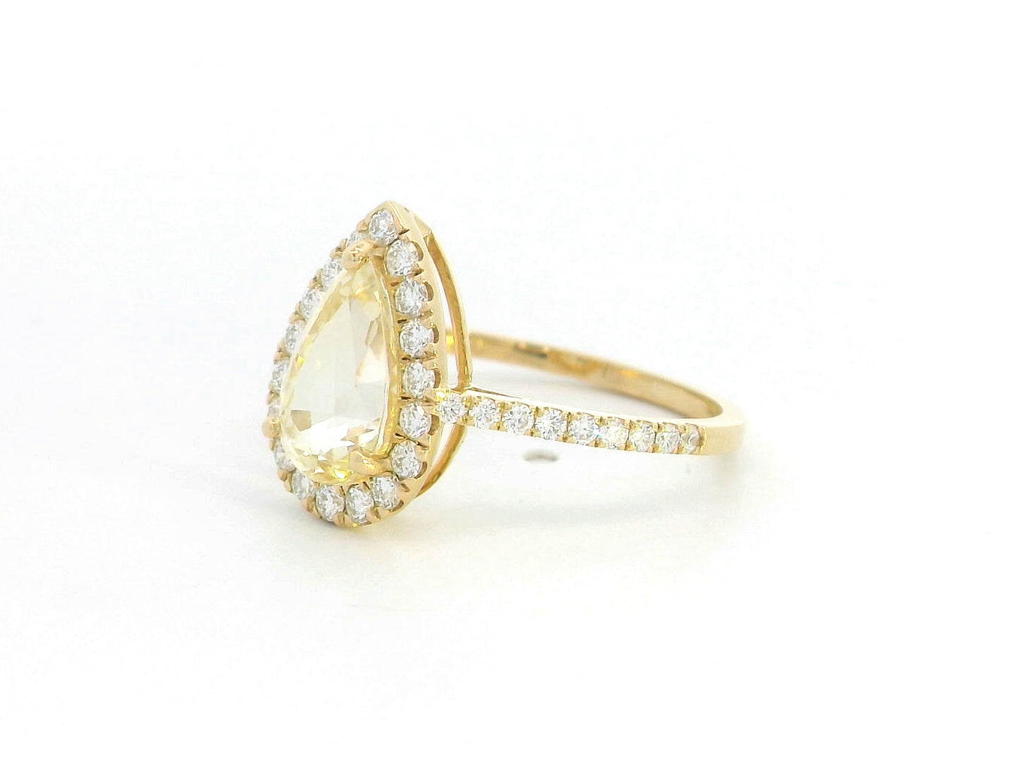 18K yellow gold ring with 2.18ct pear-shaped yellow sapphire and 0.48ct diamond halo and band
