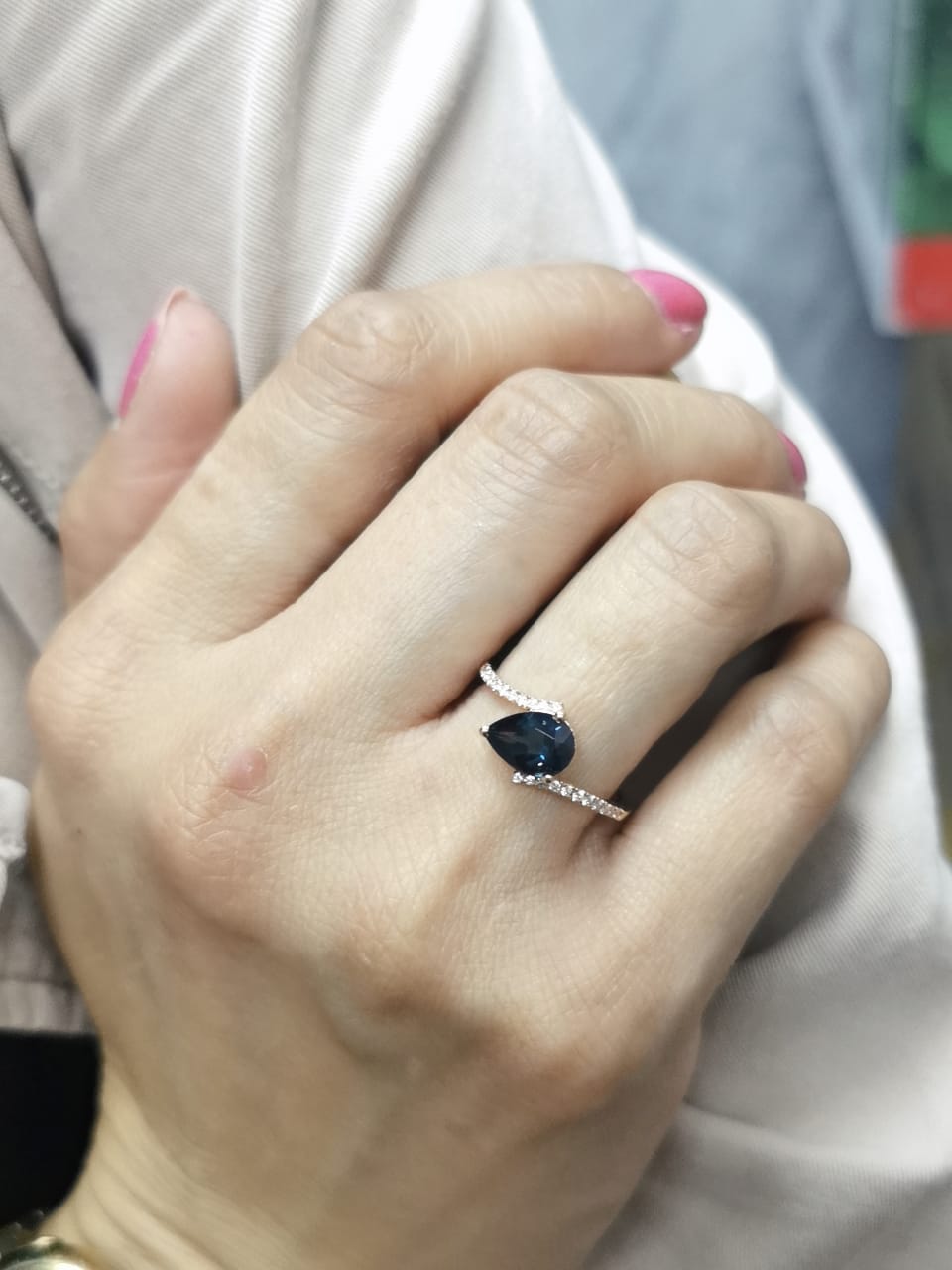 18K rose gold ring with pear-shaped London Blue Topaz and pavé diamond band