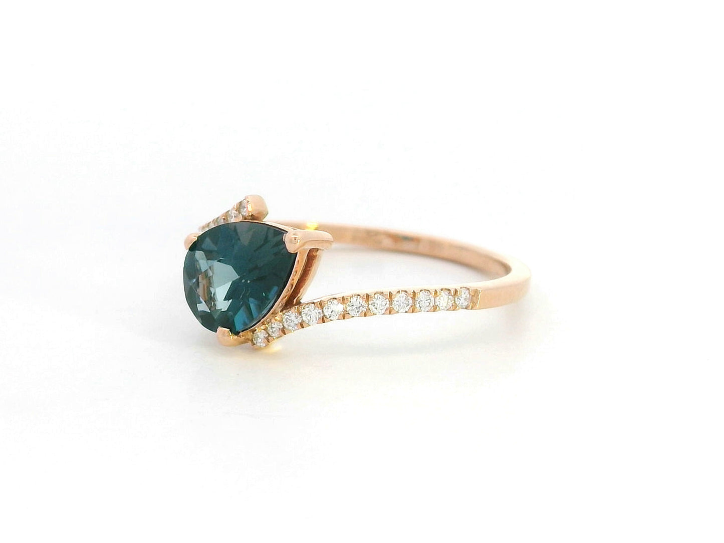 18K rose gold ring with pear-shaped London Blue Topaz and pavé diamond band
