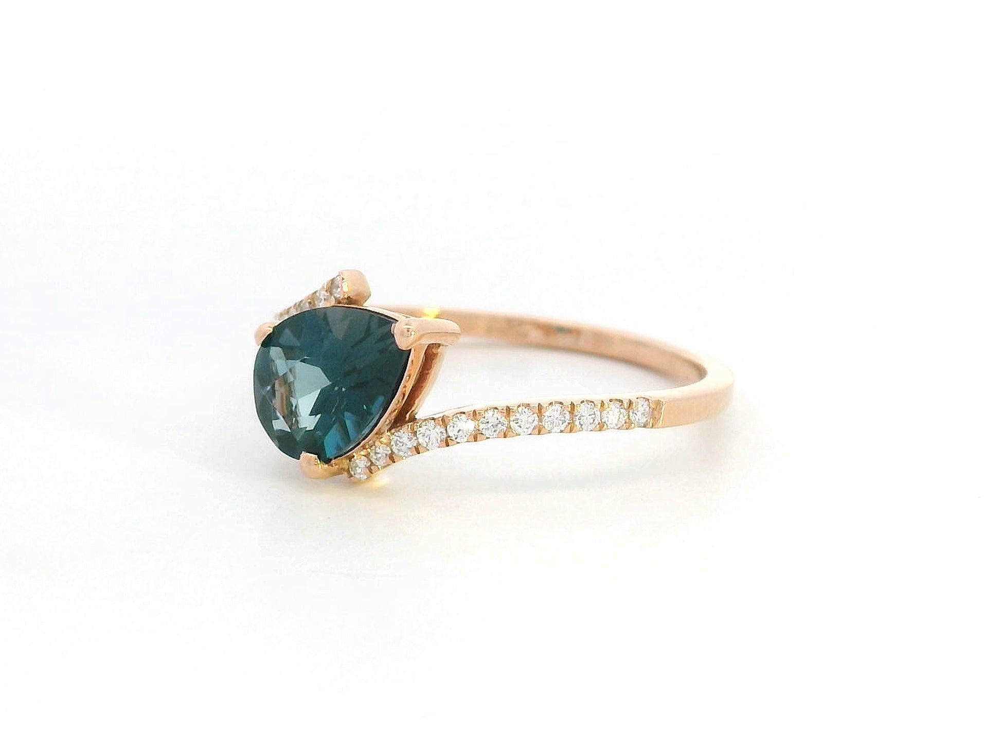 18K rose gold ring with pear-shaped London Blue Topaz and pavé diamond band
