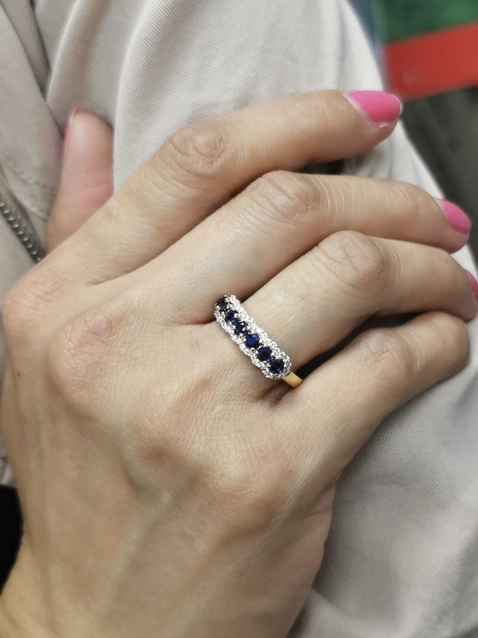 18K yellow gold half eternity ring with round blue sapphires and diamond accents on both sides