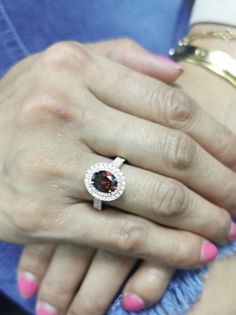 18K rose gold ring with oval garnet and double diamond halo – 2.24ct garnet, 0.63ct diamonds