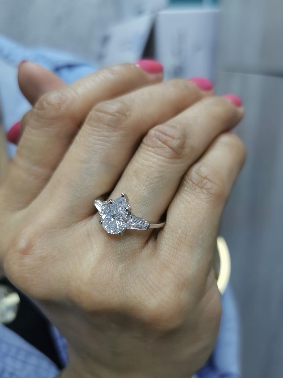 18K white gold ring with 2.01 carat pear-cut GIA-certified diamond and tapered baguette side stones