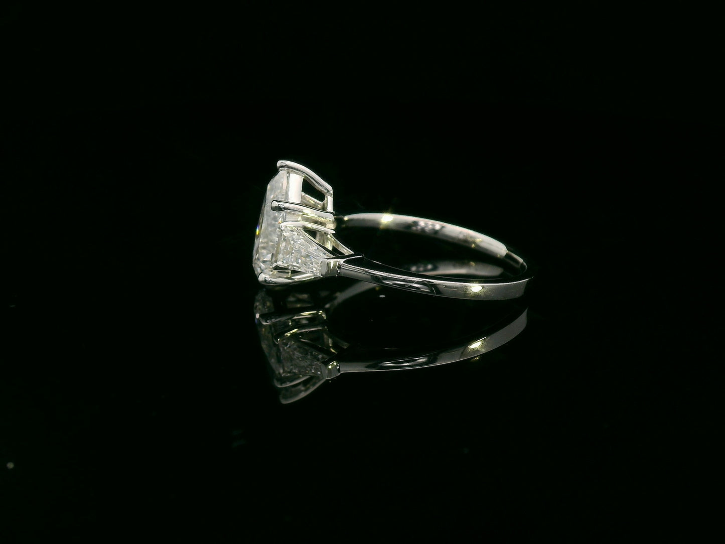18K white gold ring with 2.01 carat pear-cut GIA-certified diamond and tapered baguette side stones