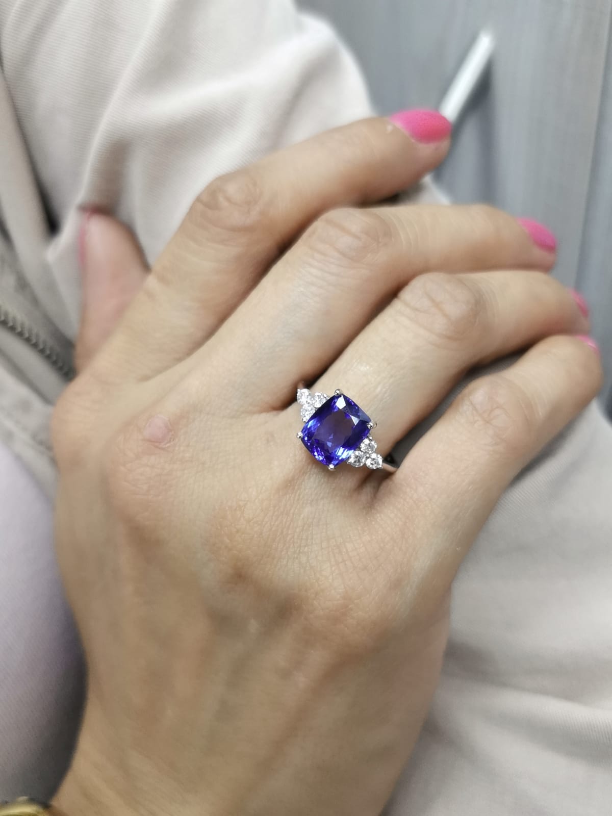 18K White Gold Cushion-Cut Tanzanite Ring with three Diamonds on the shoulder – 3.50ct center stone and 0.33ct round diamonds