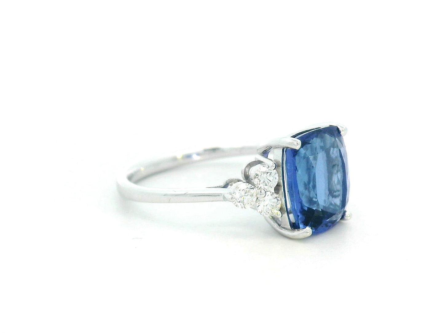 18K White Gold Cushion-Cut Tanzanite Ring with three Diamonds on the shoulder – 3.50ct center stone and 0.33ct round diamonds