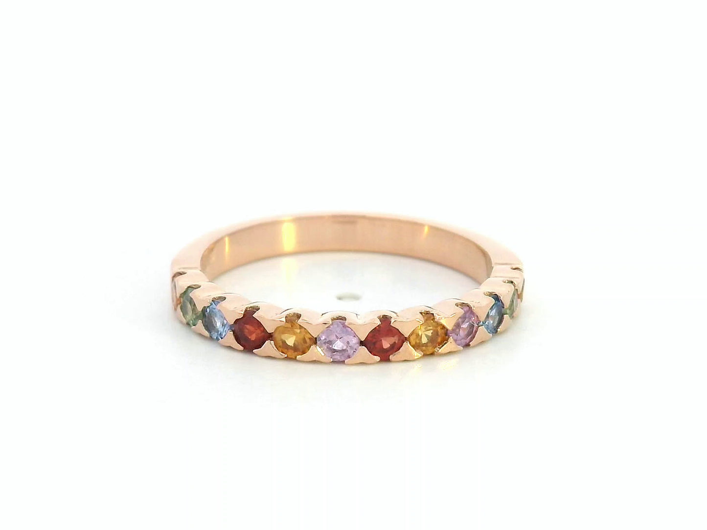 18K rose gold ring set with 0.93 carats of multicolored round sapphires in a half band design