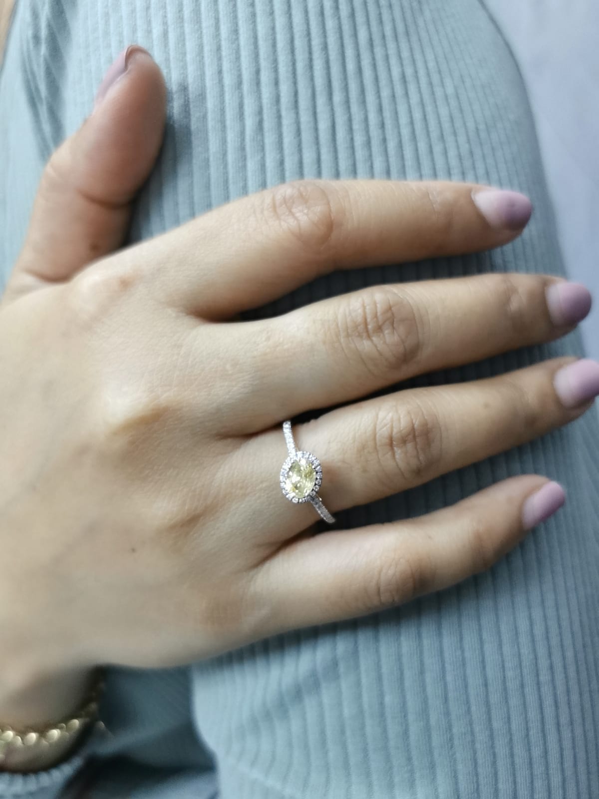 18K Gold Yellow Oval-shape Sapphire Ring with Diamond Halo.