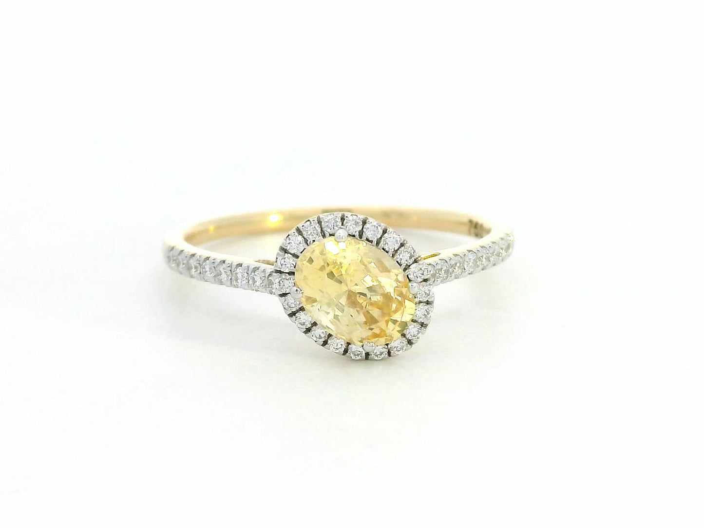 18K Gold Yellow Oval-shape Sapphire Ring with Diamond Halo.