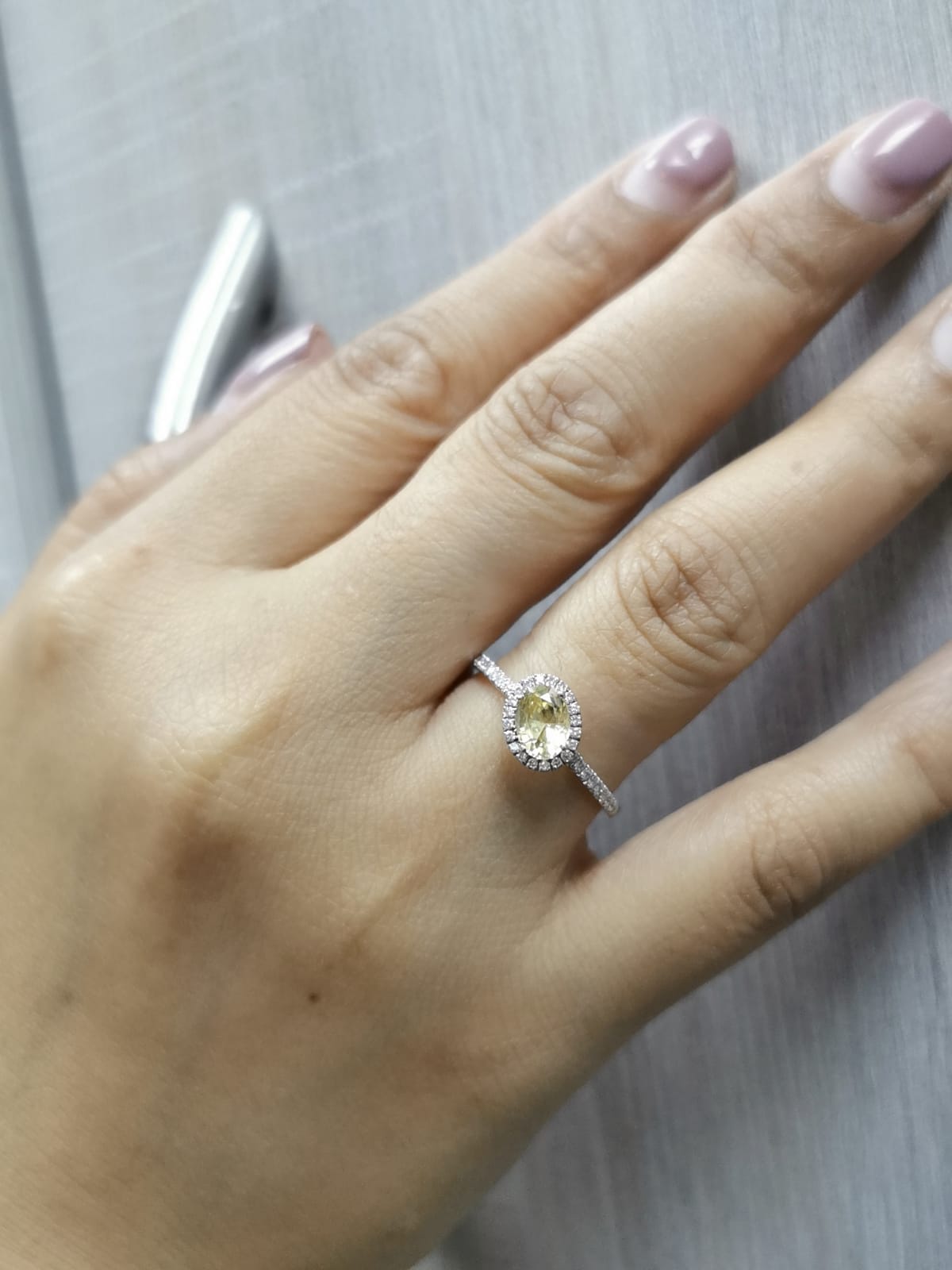 18K Gold Yellow Oval-shape Sapphire Ring with Diamond Halo.