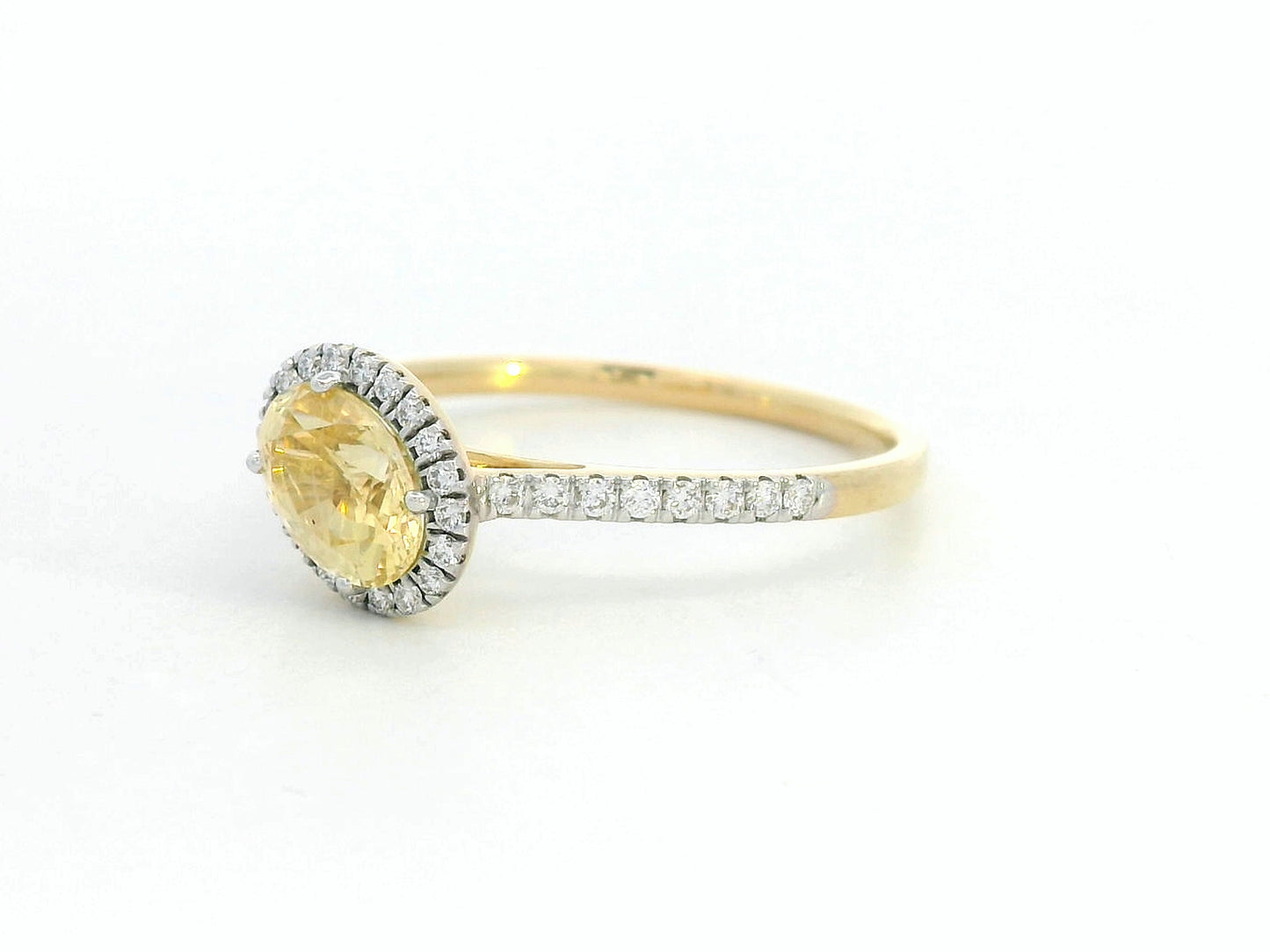 18K Gold Yellow Oval-shape Sapphire Ring with Diamond Halo.