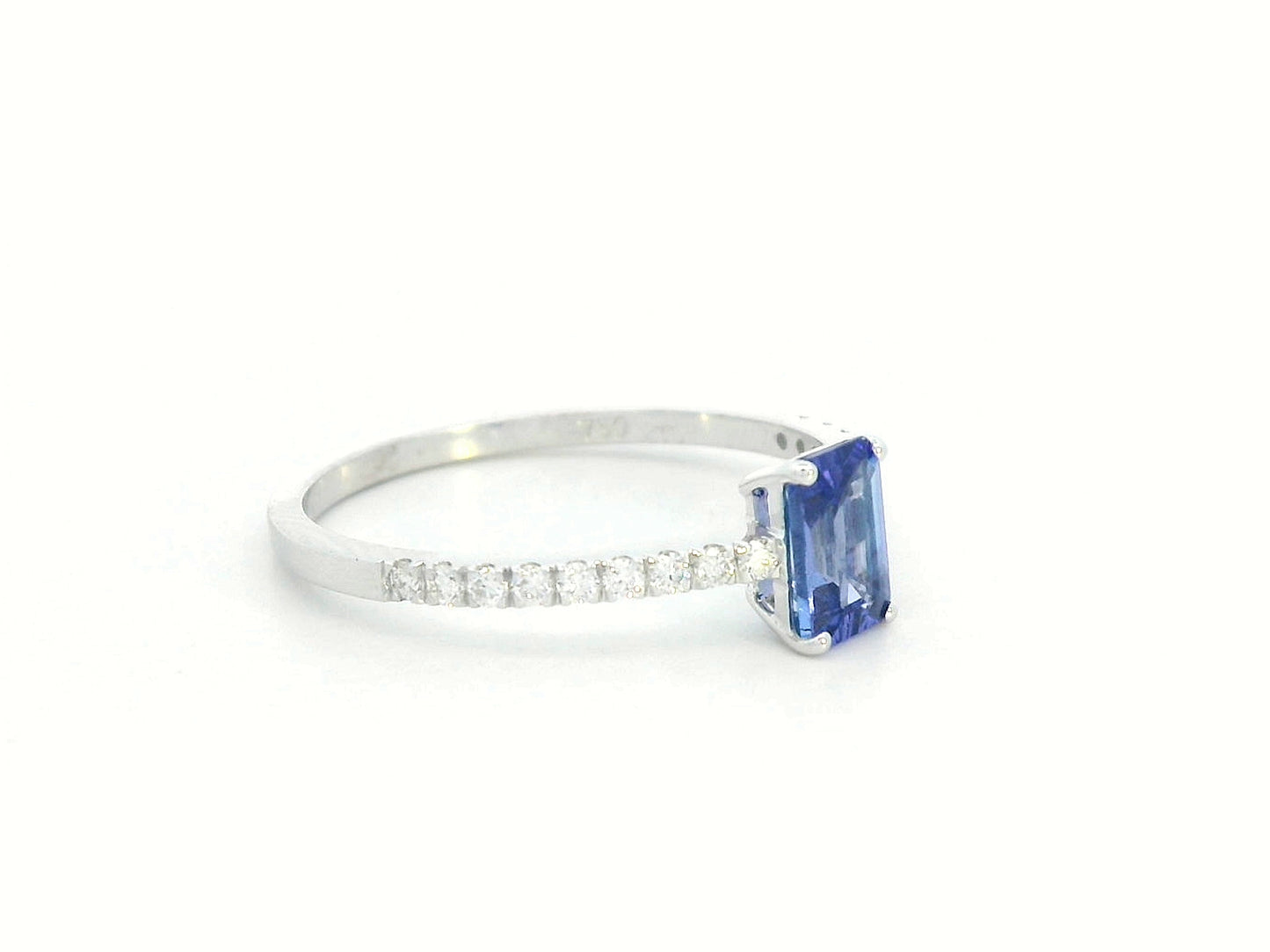 Emerald-cut Tanzanite ring in 18K white gold with diamond-accented band – 0.56ct center stone