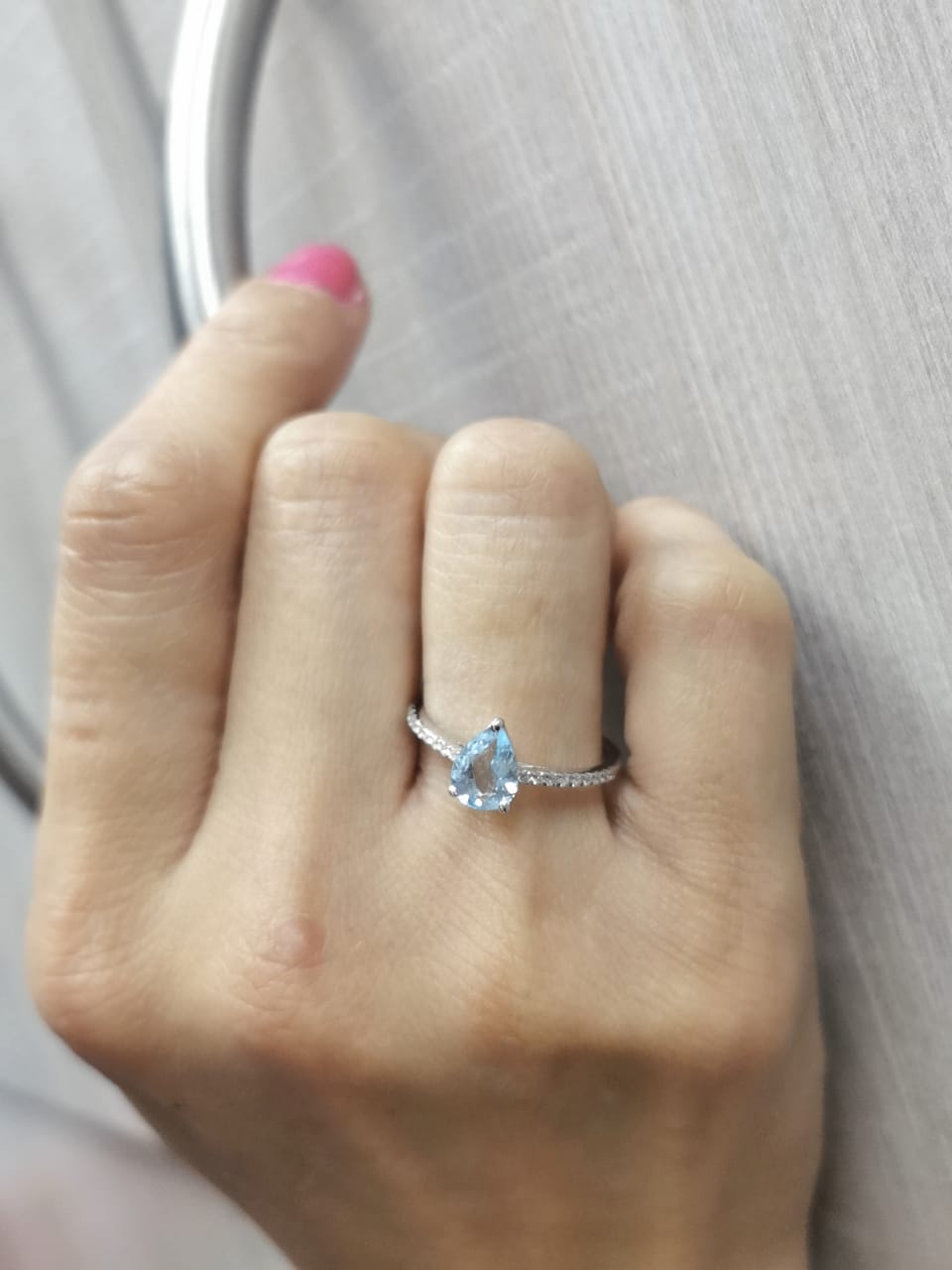 Pear-cut aquamarine ring in 18K white gold with pavé diamond band – 0.68ct aqua, 0.13ct diamonds