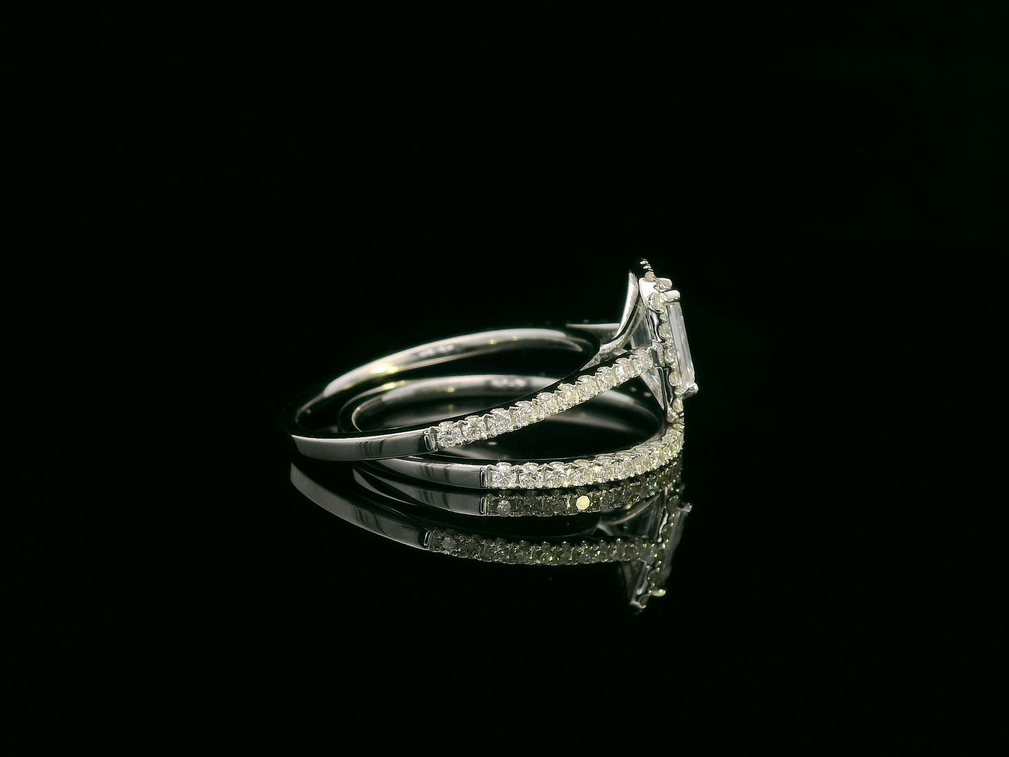 18K white gold bridal set with emerald-cut 1.00ct diamond, halo engagement ring, and half-eternity diamond band