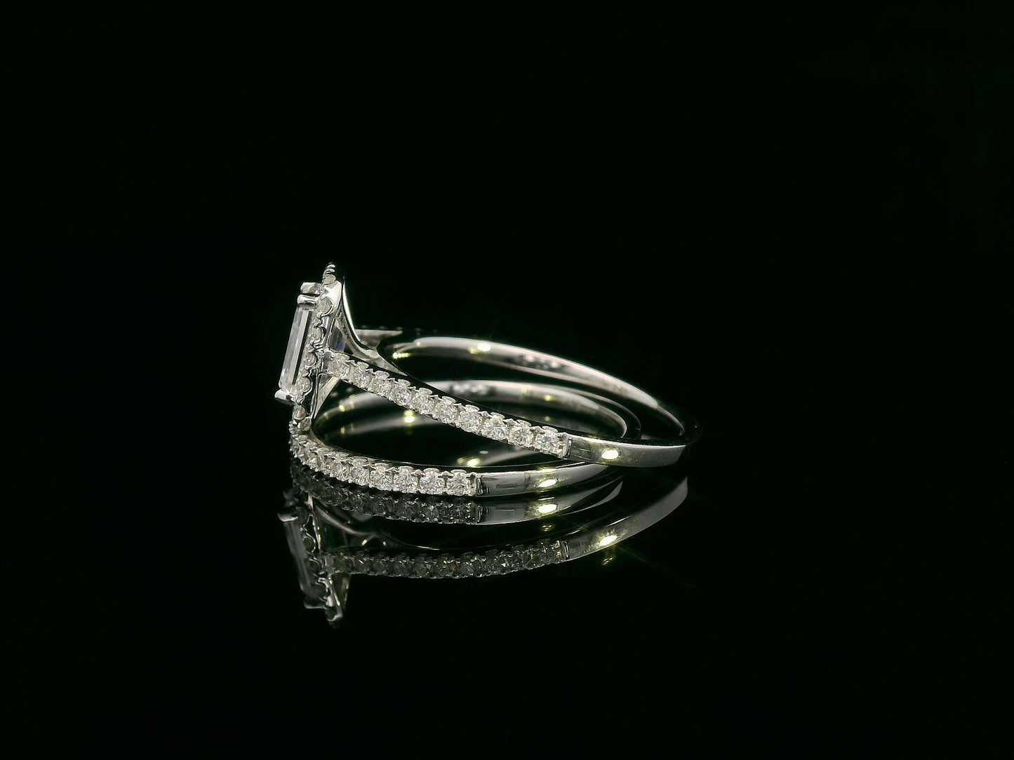 18K white gold bridal set with emerald-cut 1.00ct diamond, halo engagement ring, and half-eternity diamond band