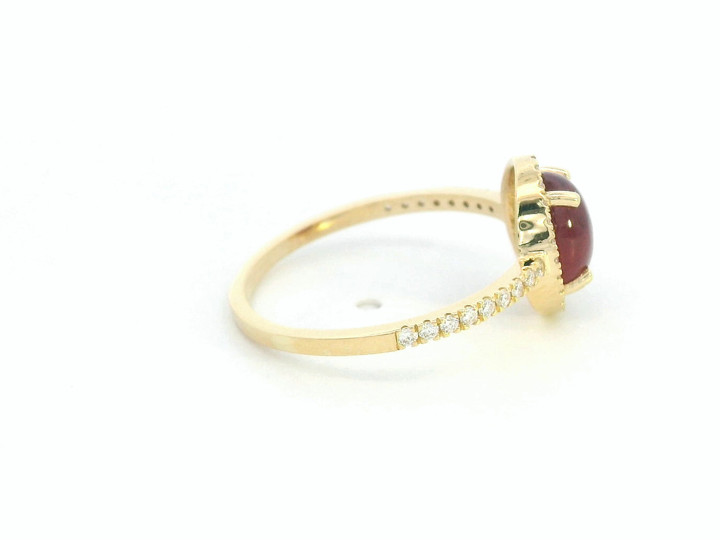 18K yellow gold ring with 1.94ct oval cabochon ruby and 0.25ct diamond halo