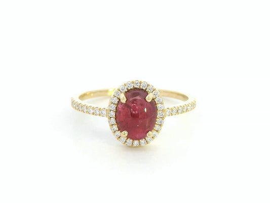 18K yellow gold ring with 1.94ct oval cabochon ruby and 0.25ct diamond halo
