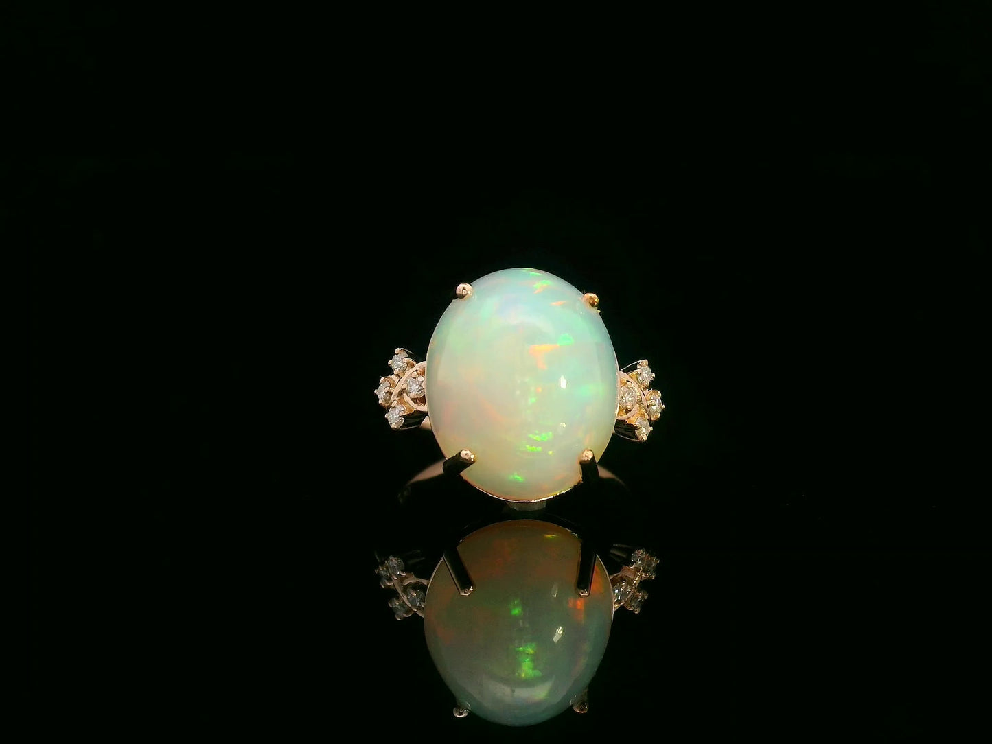 18K rose gold ring with 5.44ct oval opal cabochon and artistic diamond-accented side design