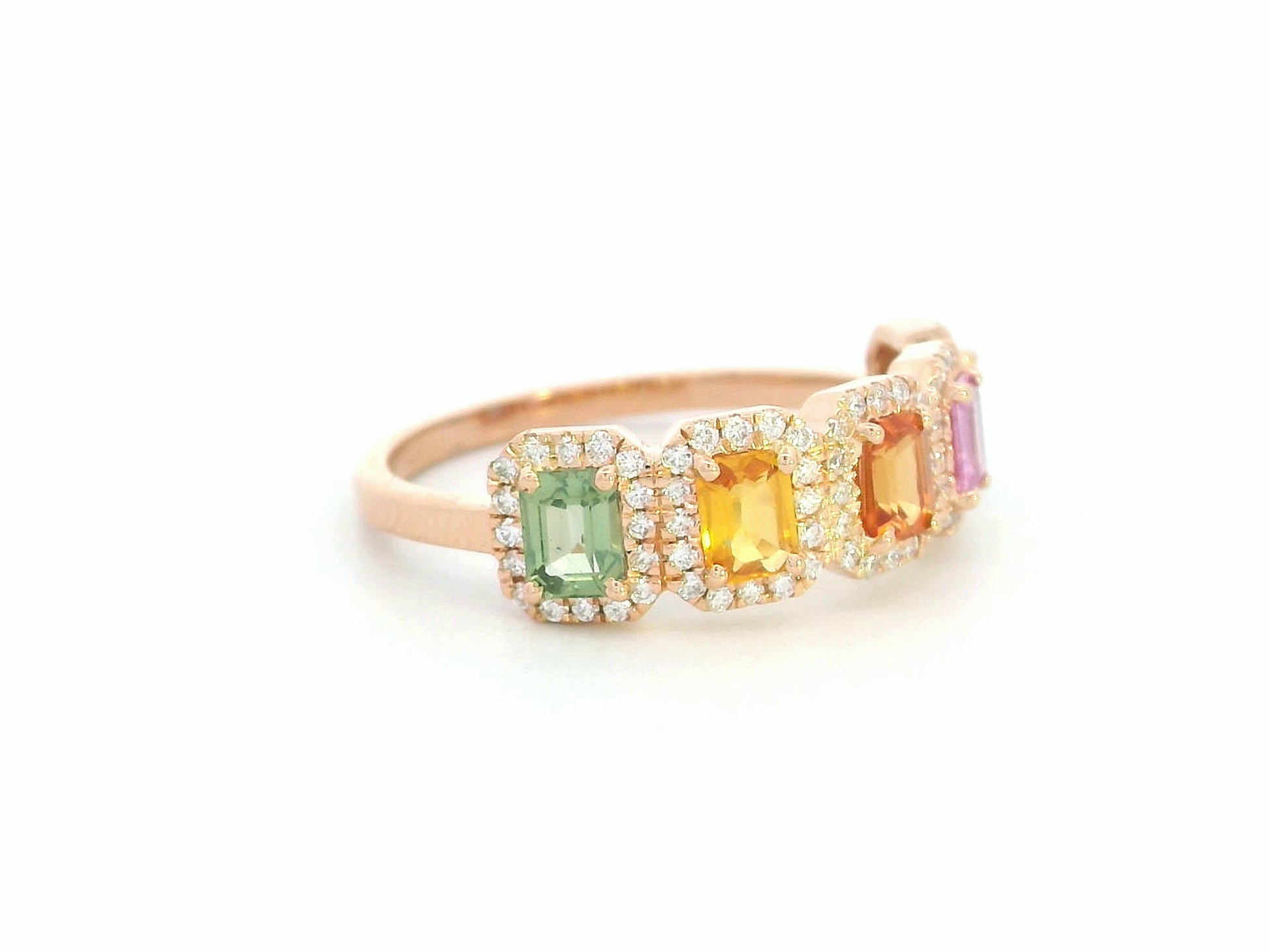 18K rose gold ring with emerald-cut multi-color sapphires and diamond halos