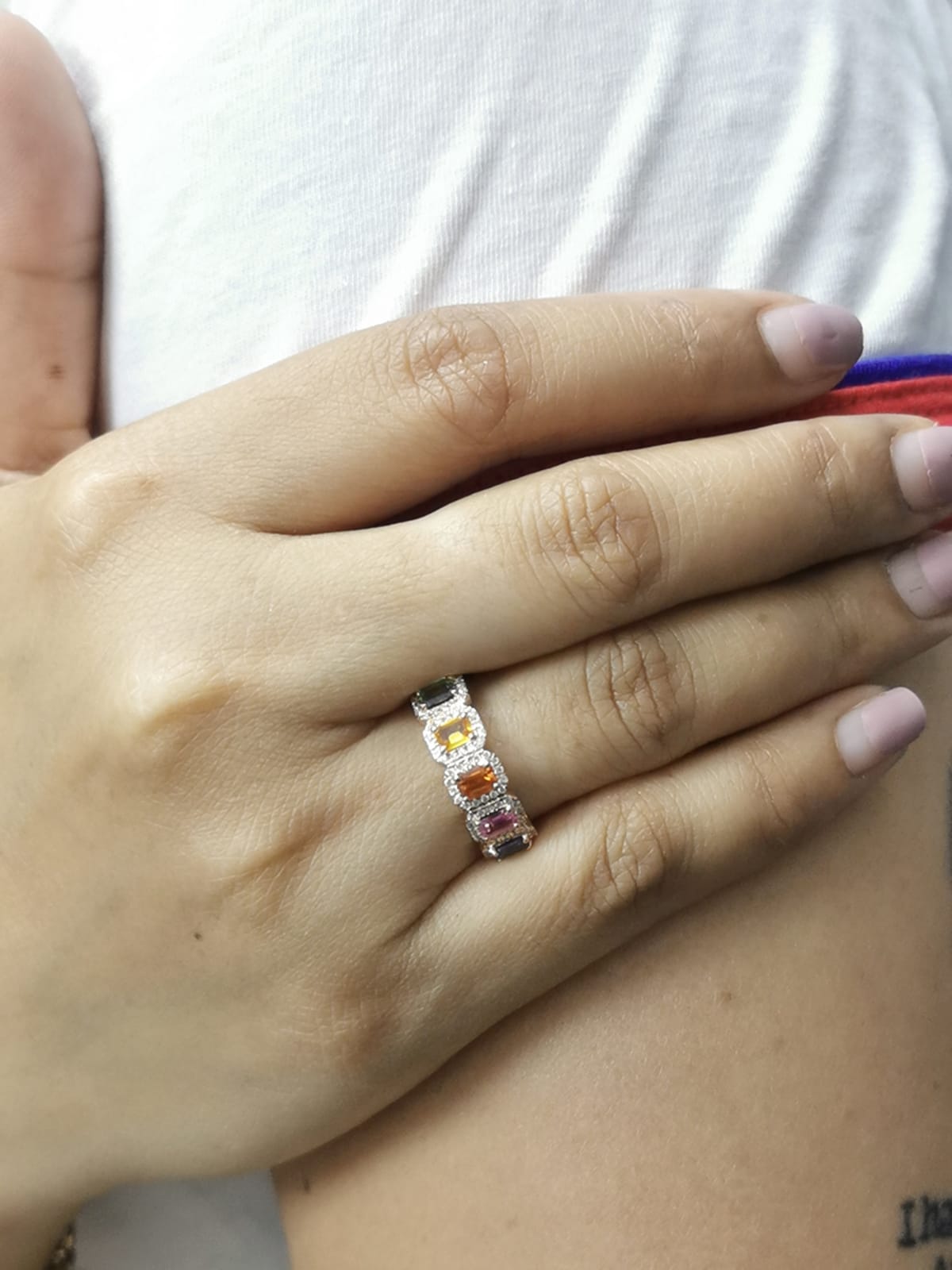18K rose gold ring with emerald-cut multi-color sapphires and diamond halos