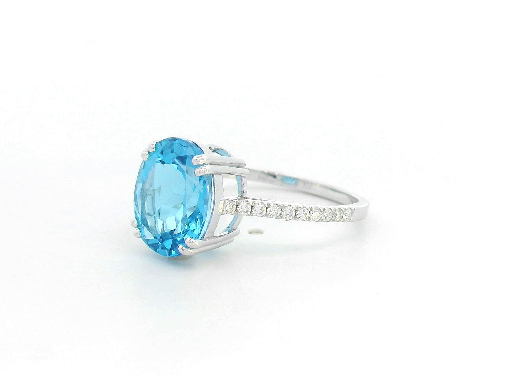 18K white gold ring with 4.58 carat oval Swiss Blue Topaz and diamond-accented band