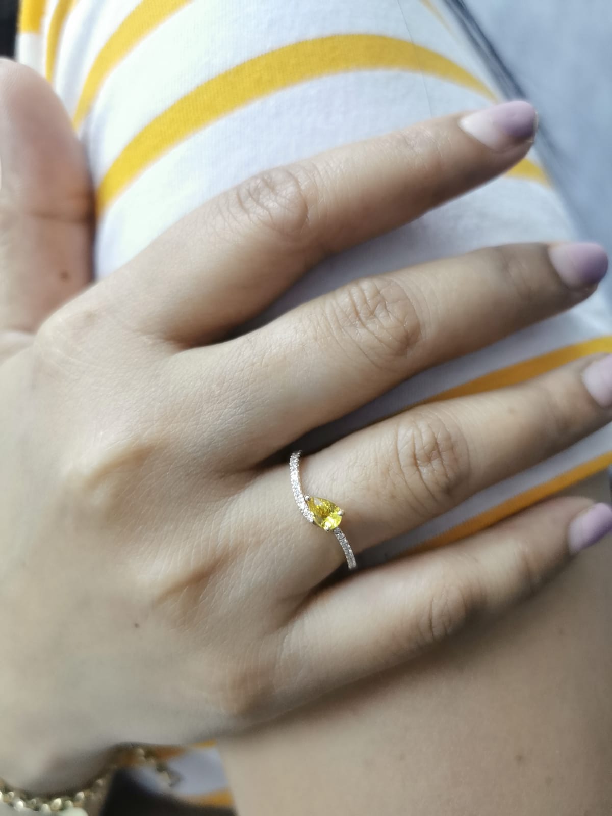 Elegant bypass ring with yellow sapphire and pave diamond
