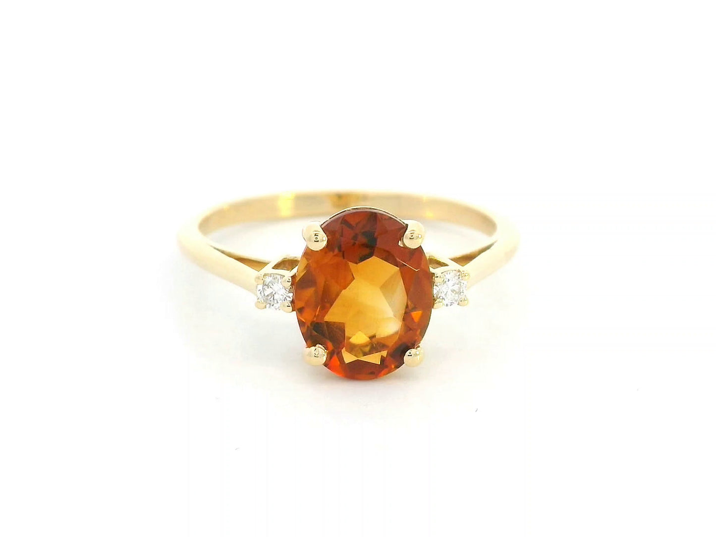 Oval citrine ring with diamond accents in 18K yellow gold