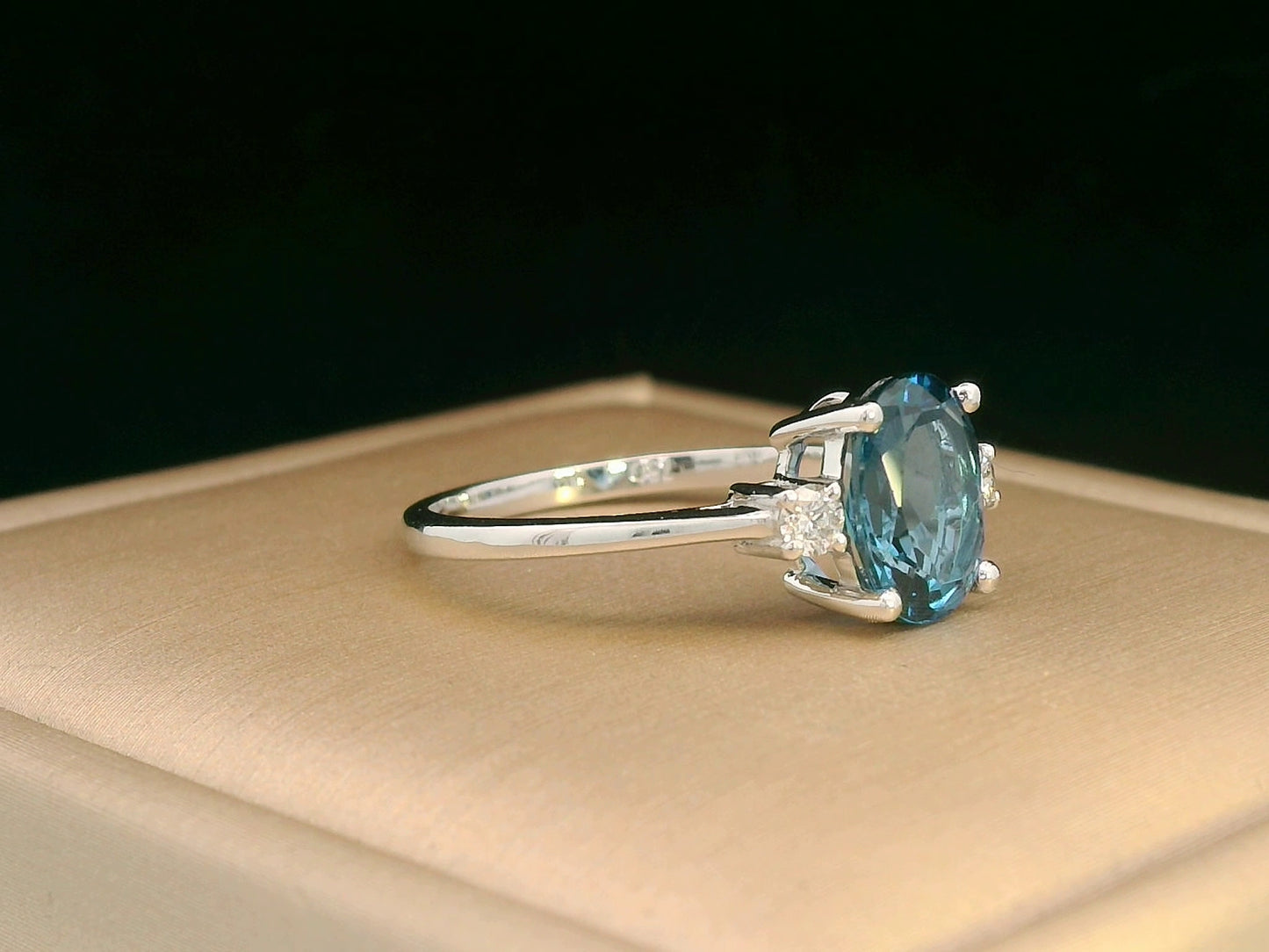 Elegant gemstone ring with oval-cut topaz and diamond accents