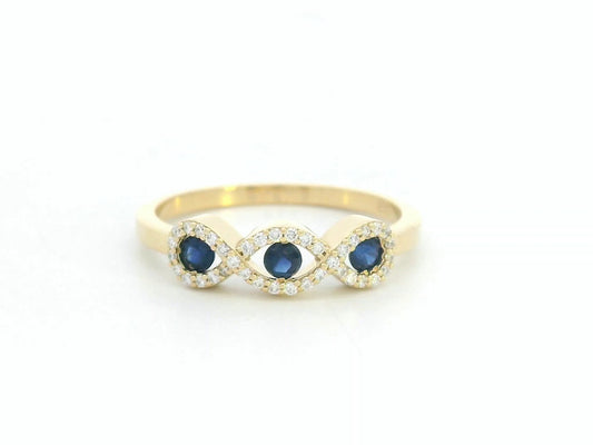 18K gold infinity ring with blue sapphires and diamonds