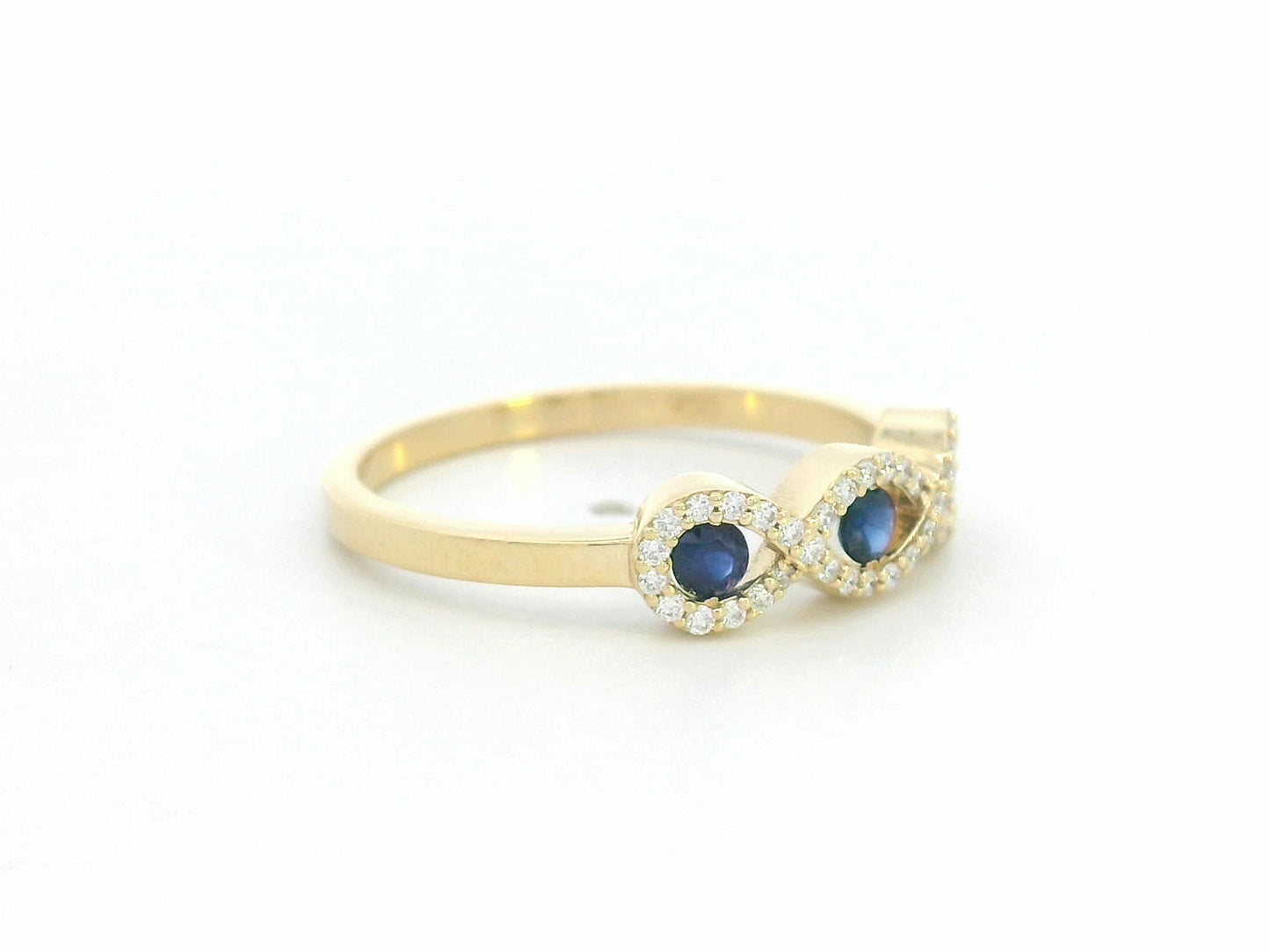 Elegant infinity motif gold ring with sapphires and diamonds