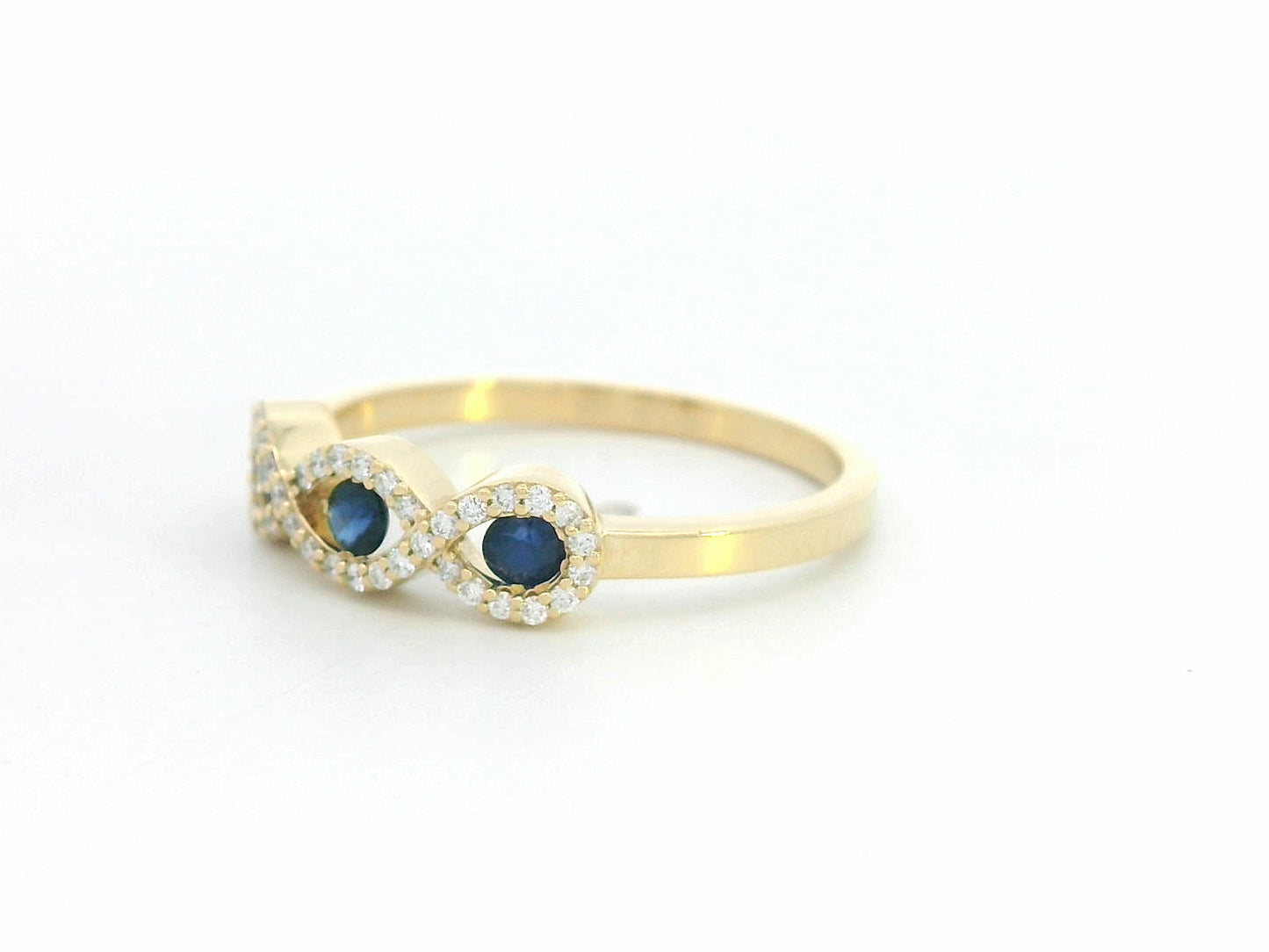 Luxury women’s ring with 0.27ct sapphires and 0.12ct diamonds in gold infinity setting