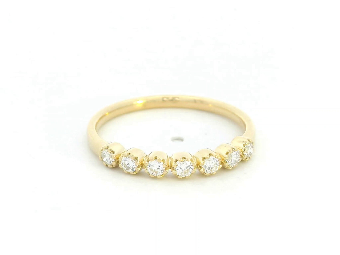 18K yellow gold half eternity ring with seven round diamonds