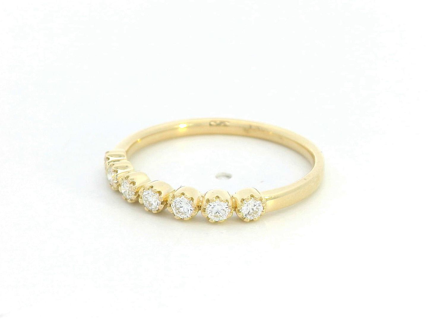 Diamond 7-stone ring with rounded prong settings