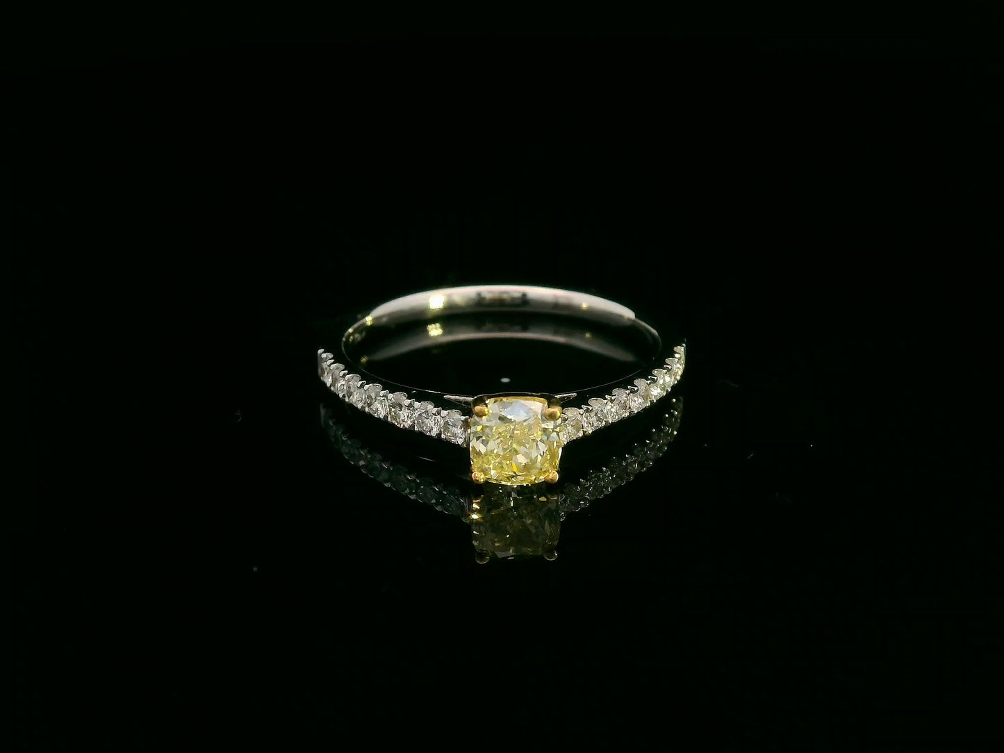 Cushion-cut fancy yellow diamond ring in 18K white gold