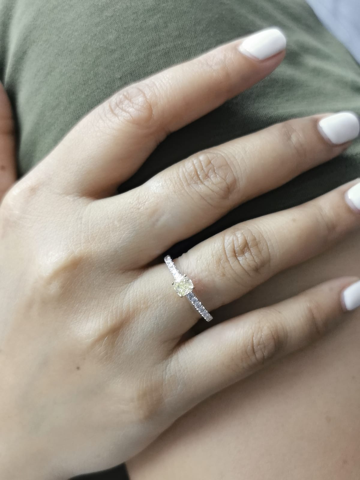 White gold ring with cushion yellow diamond and side diamonds