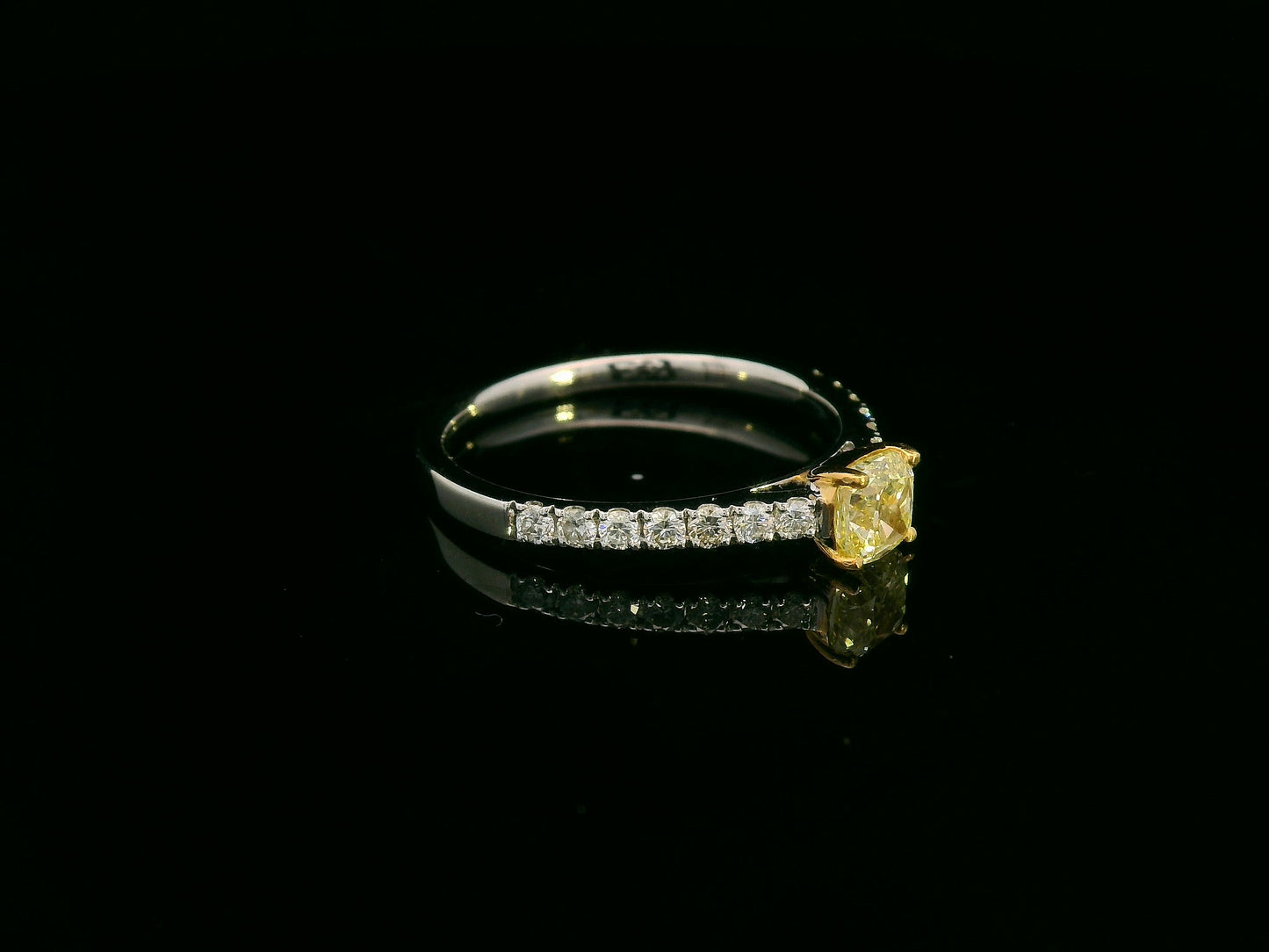 0.57 carat yellow diamond engagement ring with pave diamond band