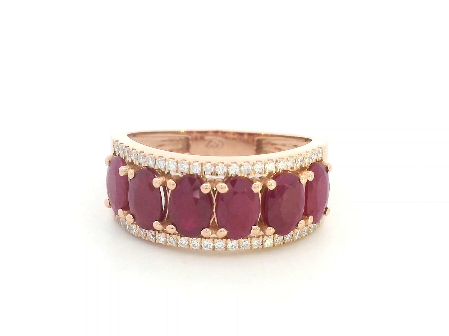 18K rose gold ring with oval rubies and diamond borders